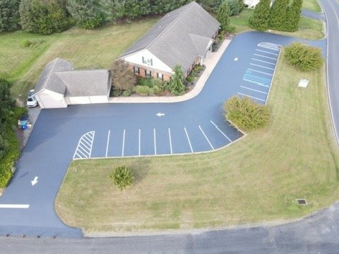 Residential driveway with freshly painted basketball court markings
