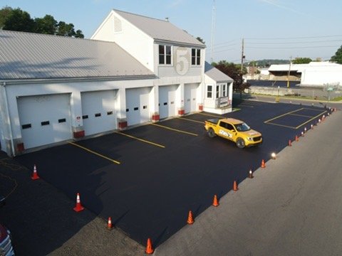 Commercial building entrance with newly painted parking lot striping