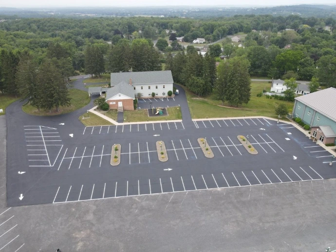 Freshly striped commercial parking lot with clear directional markings