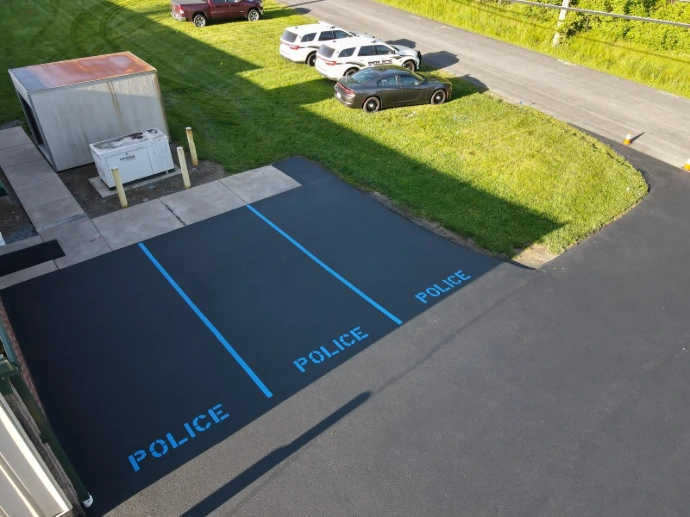 Freshly painted blue parking space striping for commercial property