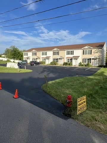 Cleared residential driveway and sidewalk after professional snow removal