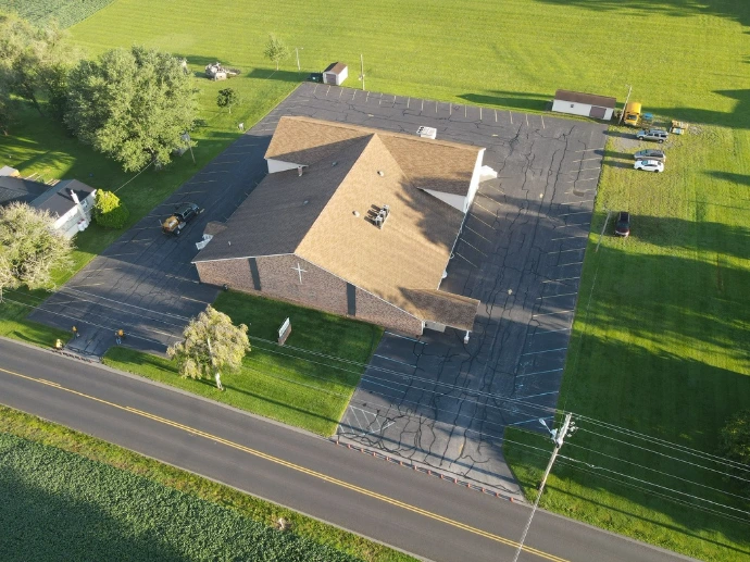 Aerial view of residential property maintained during winter snow removal services