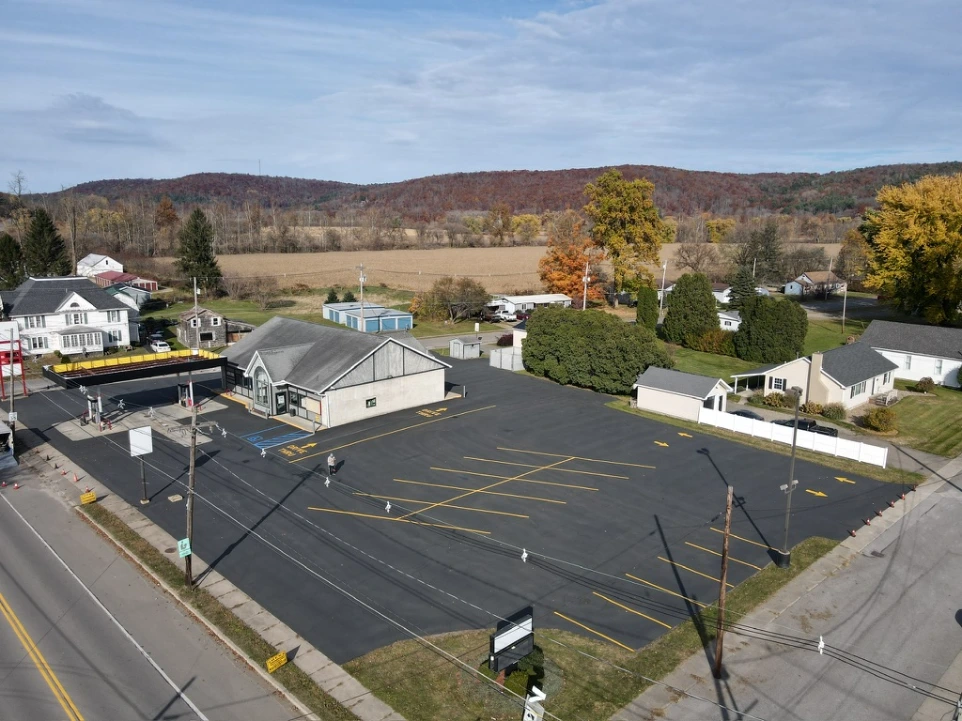 Freshly paved commercial parking lot with crisp asphalt surface