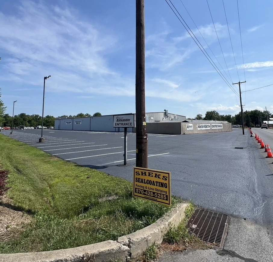 Aerial view of commercial parking lot resurfacing and sealcoating project